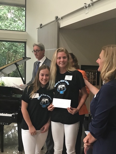 Young volunteers receiving recognition at awards ceremony