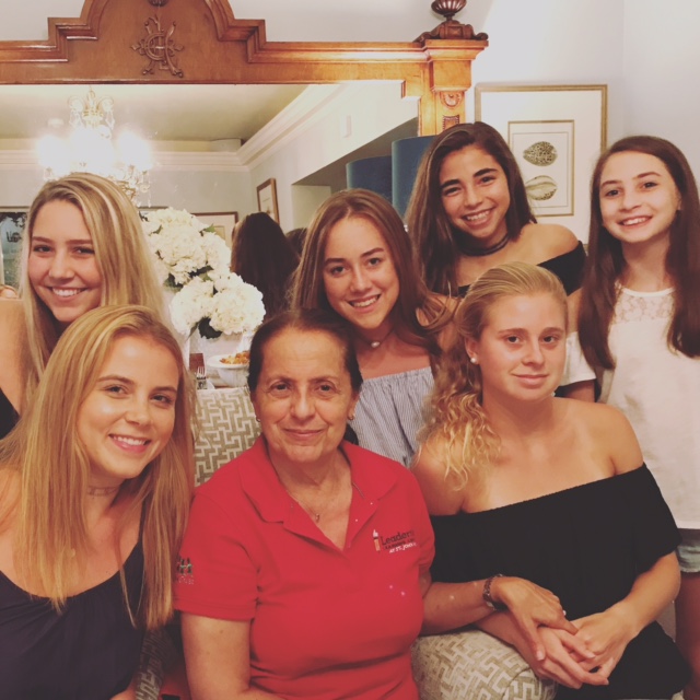 Volunteers with community member in home setting