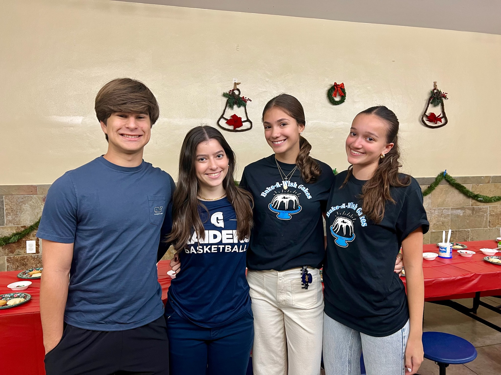 Group of Bake-A-Wish volunteers at holiday cookie decorating event